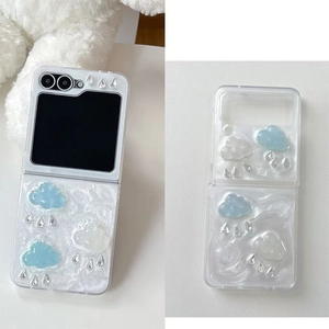 Detail of Galaxy Z Flip case featuring 3D resin clouds and silver teardrop accents