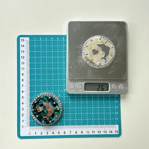 Macro view of rhinestone magnetic phone holder with dolphin design showing 26g weight