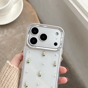 Detailed macro of transparent glitter phone case with 3D tulip flowers and pearls