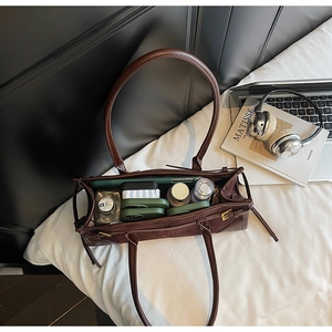 Top view of large brown tote bag showing spacious interior for essentials and gadgets