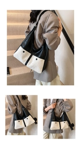 Detail of the high-quality patchwork hobo bag with contrast faux shearling and leather textures