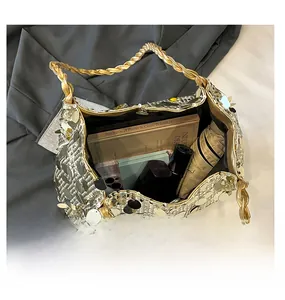 Top view of large gold sequin tote bag showing interior capacity for essentials