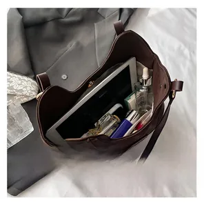 Top view of large capacity brown leather tote bag interior showing spacious storage space