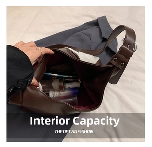 Macro view of vintage brown leather tote bag with ample internal capacity and soft lining