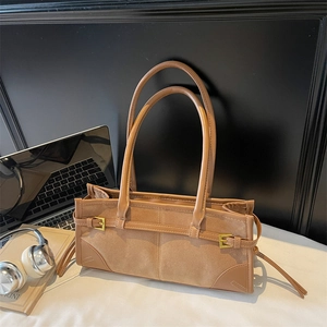 Brown suede and leather hobo tote bag with long handles and golden buckle detail