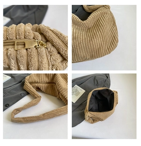 Détails du sac fourre-tout en velours côtelé kaki, texture du tissu et fermeture éclair