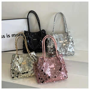 Four sequined tote bags in black, silver, gold, and pink with woven handles