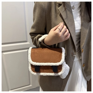 Detail of brown faux suede bag with fuzzy sherpa trim and matching plush coin purse