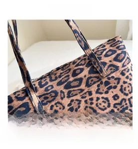 Close-up of leopard print tote bag showing refined stitching and textile texture