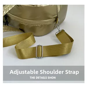 Detail of adjustable wide fabric shoulder strap with silver metal buckle on a padded bag