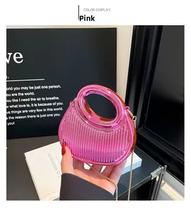 Detail of pink metallic crossbody bag with vertical pleats and golden chain strap