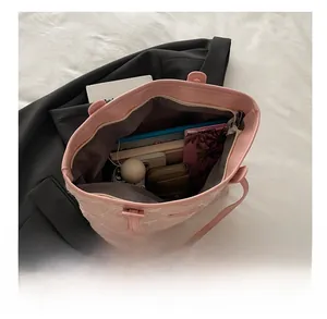 Detail view of pink floral tote bag interior showing large capacity for essentials