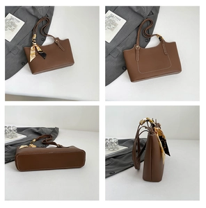 Detail view of brown PU leather tote bag with white stitching and vintage floral silk scarf