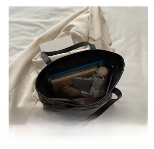 Spacious leopard print tote bag interior showing capacity for tablet, books and essentials