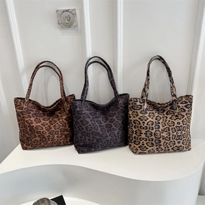 Three minimalist leopard print canvas tote bags in brown, grey, and beige for women