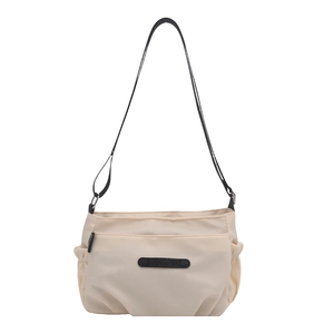 Minimalist cream nylon crossbody tote bag with adjustable strap and large capacity