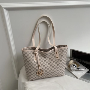 Off-white tote bag with gray M-letter print and golden charm for daily commuting