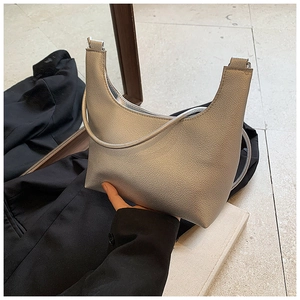 Close-up of metallic silver hobo bag featuring premium pebble-textured faux leather