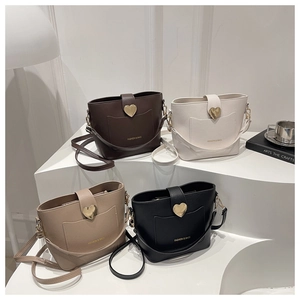 Collection of chic bucket bags with golden heart buckles in four stylish colors