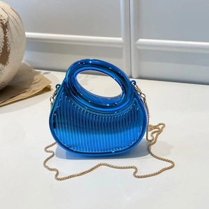 Modern bright blue metallic handbag with vertical embossing and golden chain strap
