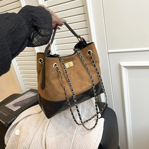 Vintage contrast color crossbody bag with gold chain and quilted suede texture