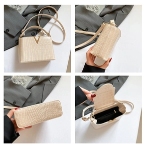Beige crocodile texture bucket bag with gold V logo and multi-angle product views
