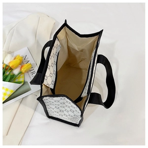 Top view of large canvas tote bag showing spacious interior and black geometric pattern