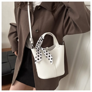 White lychee pattern bucket bag with polka dot scarf and adjustable strap detail