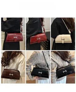 Detail showing various colors of shiny leather baguette bags with metallic H-clasp on models