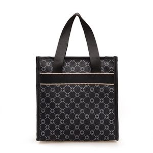 Classic black tote bag with gray clover pattern and wide woven straps for women