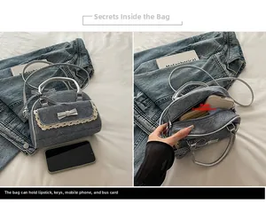 Detail showing inner capacity of denim bow bowling bag with lace trim and silver handle