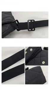 Detail view of black quilted oxford cloth bag with metal magnetic buckle and strap