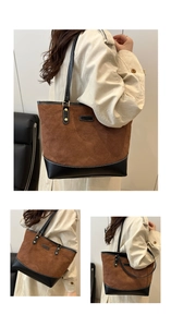Detailed macro view of large tote bag showing brown suede and black leather patchwork textures