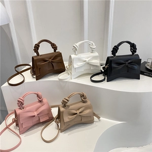 Bow accent tote and crossbody bag for women in five colors with textured matte finish