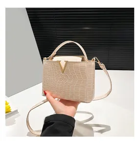 Stone pattern beige handbag with gold V-hardware and crocodile textured finish