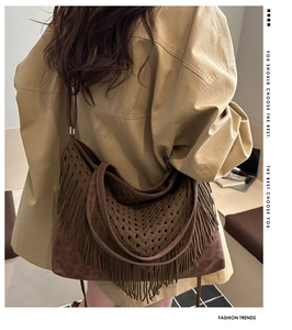Detail of crochet fringe tote bag with leopard print base and leather straps