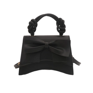 Sac à main romantique noir avec nœud surdimensionné et poignée torsadée style vintage