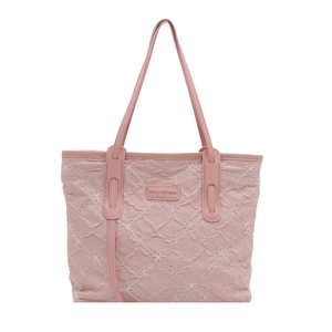 Pink quilted tote bag with floral embroidery and Tidal Dryness label on white background