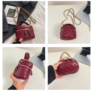 Detailed views of wine red quilted PU leather vanity bag with chain strap and dual zippers