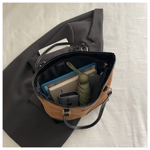 Spacious canvas tote bag interior showing capacity for tablet, notebook, and umbrella