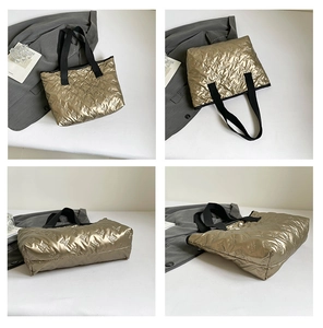 Detail view of champagne gold quilted tote bag with 3D bear pattern and black straps