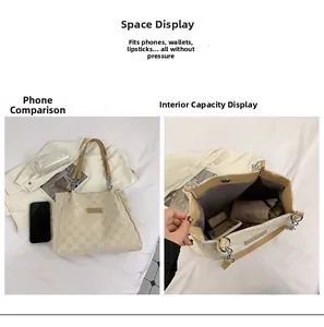 Detail view of large checkered tote bag interior capacity with leather handle