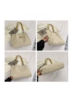 Detail view showing beige checkered tote bag texture, leather strap, and interior layout