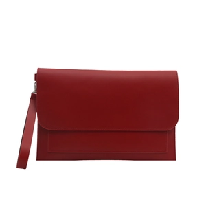 Classic red envelope clutch bag with minimalist leather texture and matching wrist strap
