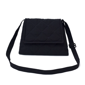 Black quilted waterproof oxford shoulder bag with adjustable strap and diamond pattern