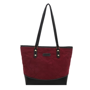 Large capacity burgundy quilted tote bag with black leather trim and top handles