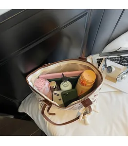 Detailed top view of a large tote bag interior showing spacious storage for daily items