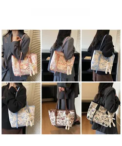 Detail view of graffiti print tote bag with cute rabbit charm in multiple colors
