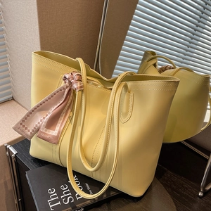 Light yellow faux leather tote bag with decorative silk scarf and large capacity for commuting