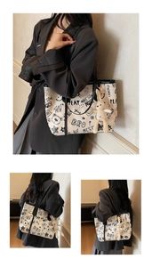 Detail of off-white tote bag with black graffiti cartoon prints and rabbit plush charm